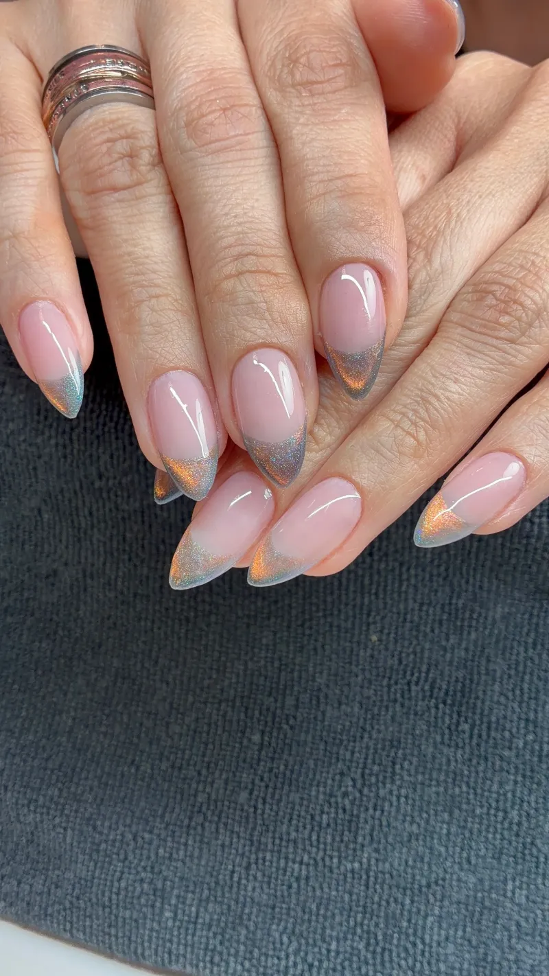 Soft pink almond nails with silver and copper chrome French tips