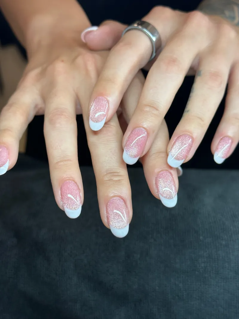 Sparkle ombré French manicure with crisp white tips