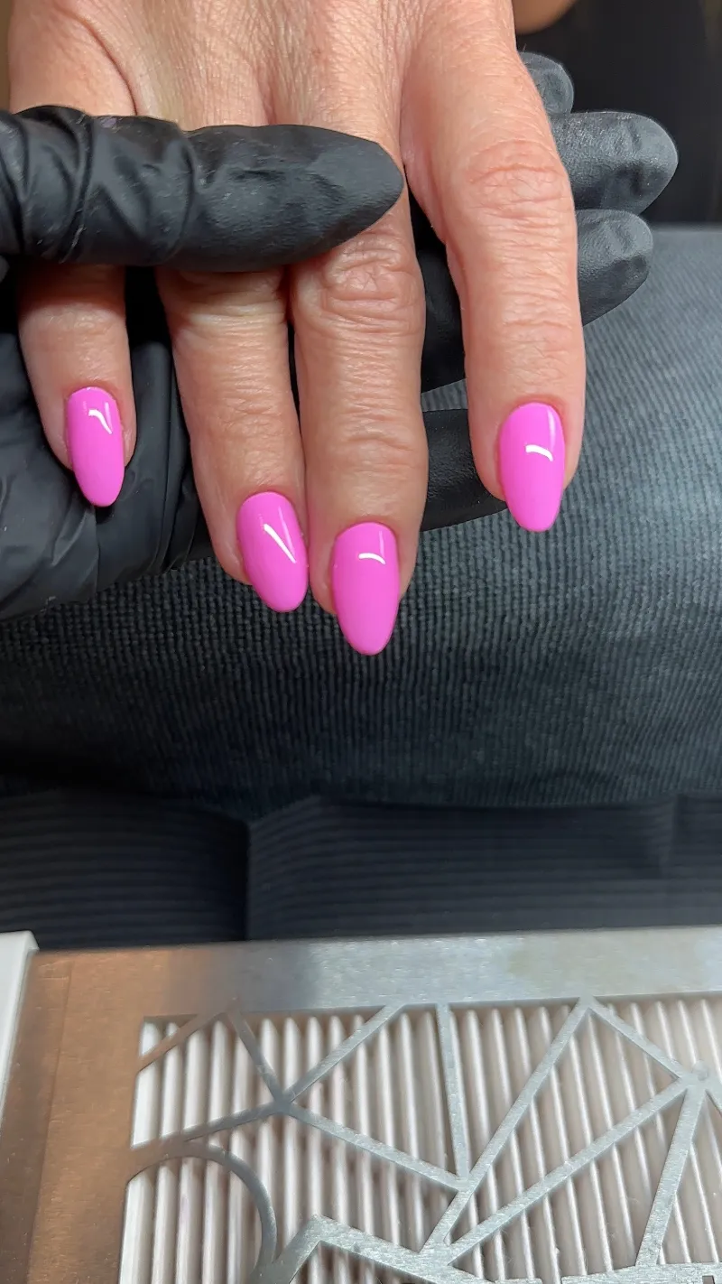 Bright pink short almond gel nails