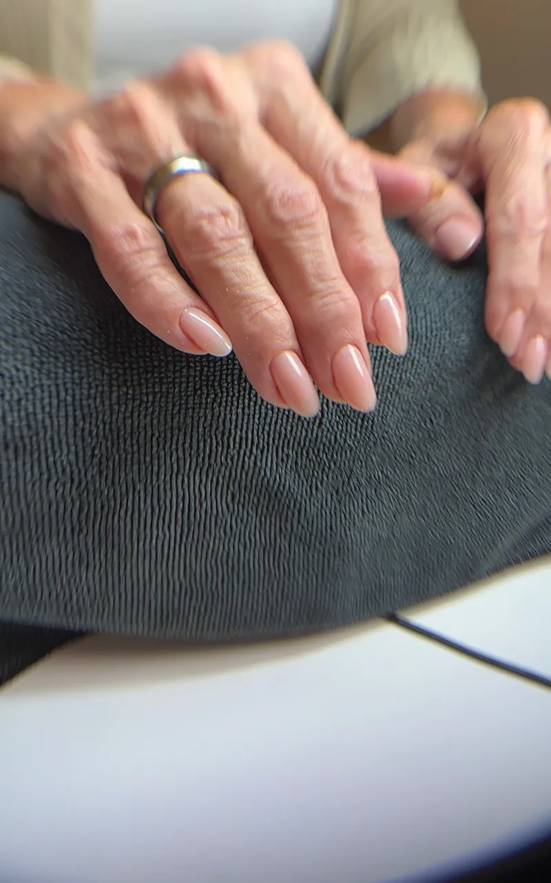 Long almond nails in a natural nude